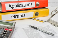 Ring binders labelled Applications and Grants